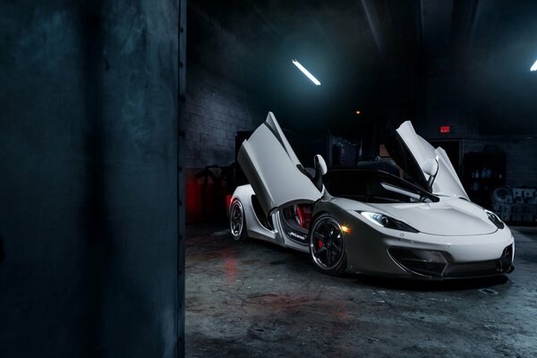 White McLaren with the doors raised up