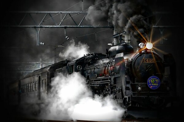 A railway locomotive releases steam