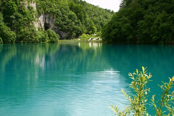 Turquoise lake shore landscape