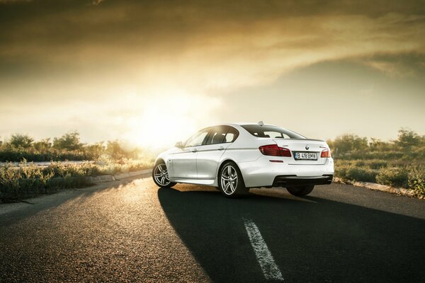 Bmw on a beautiful background. Boomer on the road