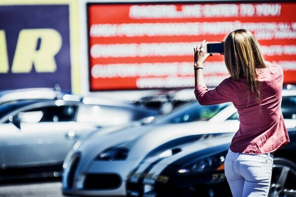 Girl on the background of beautiful cars