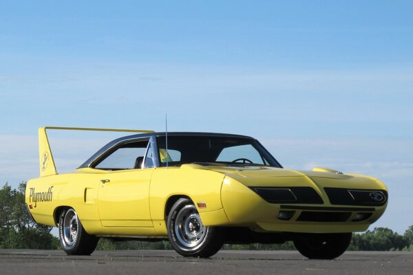 Yellow classic mopar with spoiler