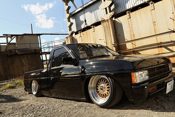 Black and understated convertible with alloy wheels