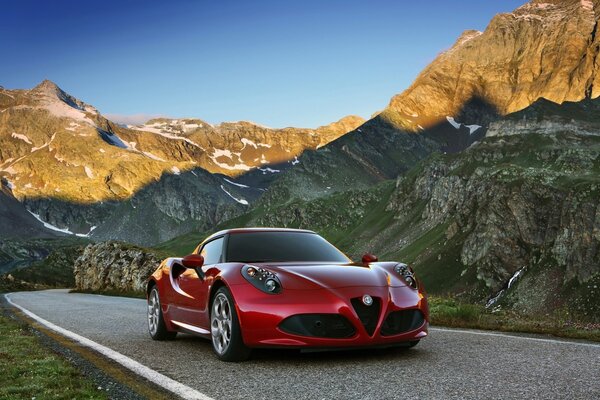 Red car on the background of mountains