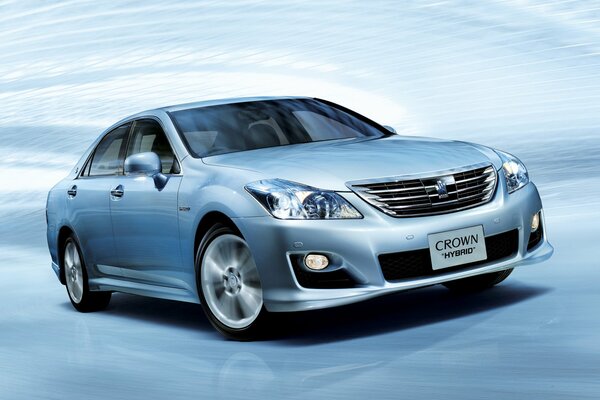 Picture of a toyota crown hybrid car on a blue background