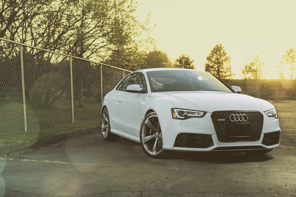 White Audi with alloy wheels