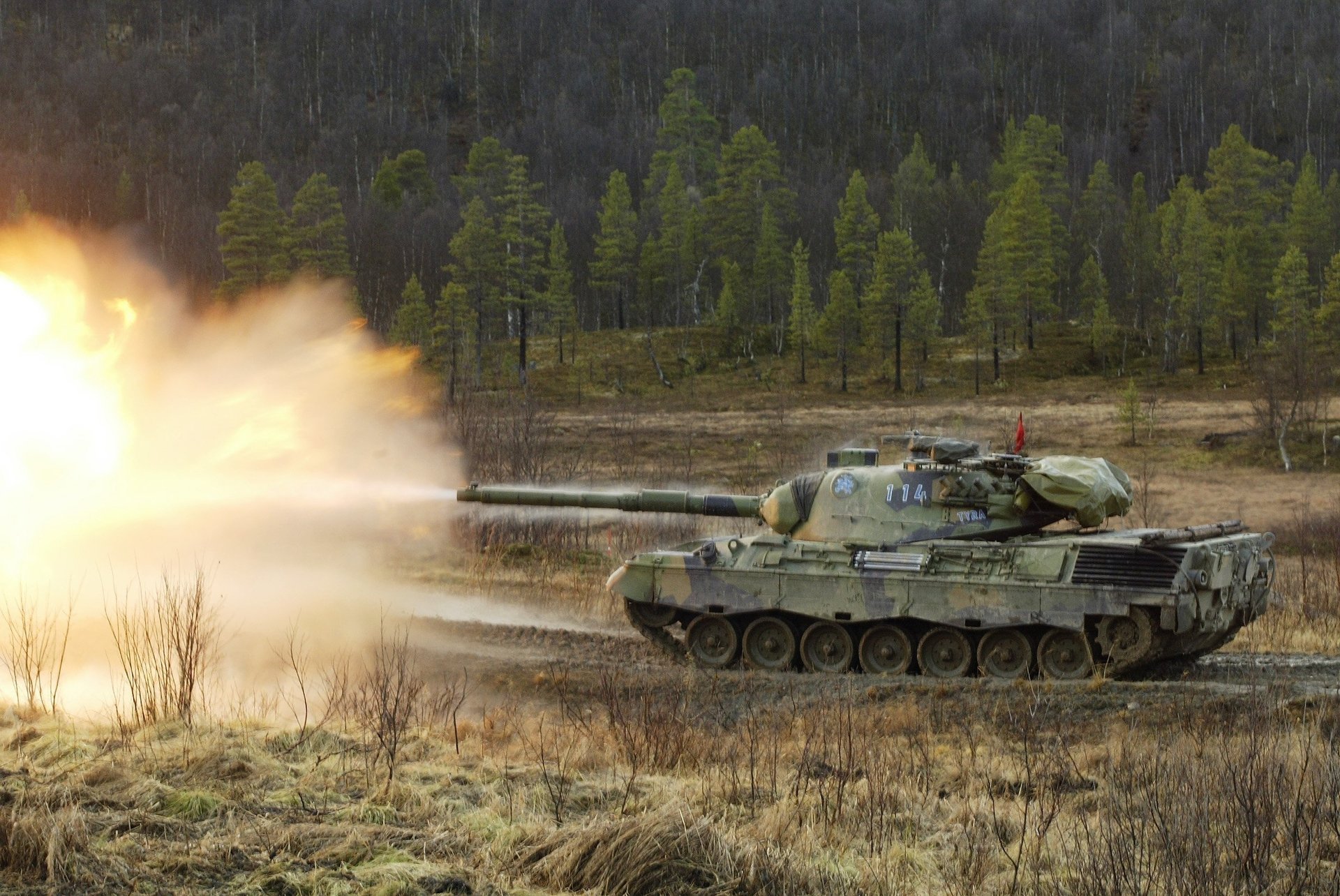 tank scorched earth leopard1 volley military equipment fire shooting war forest trees earth field road