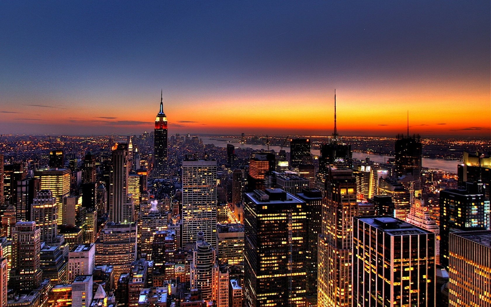 stadt sonnenuntergang metropole lichter wolkenkratzer gebäude foto dächer new york türme nachthimmel nacht lichter der städte abend new-york