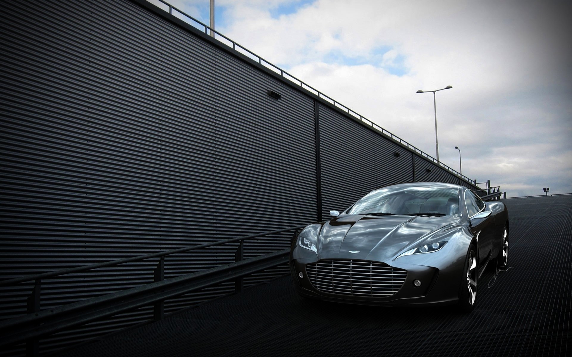 aston martin guantes concepto auto gris frente