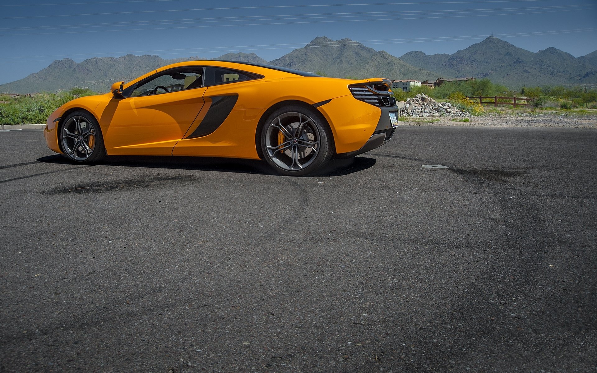 mclaren mp4-12c оранжевый маеларен небо горы