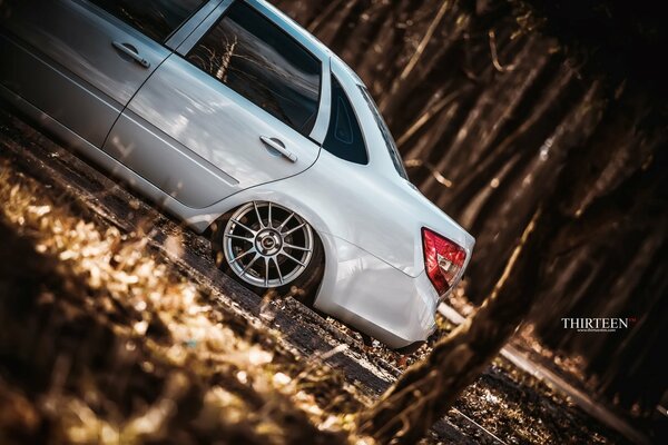 Grant s gray Lada on the background of a dry forest