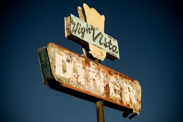 A sign on the background of the summer sky