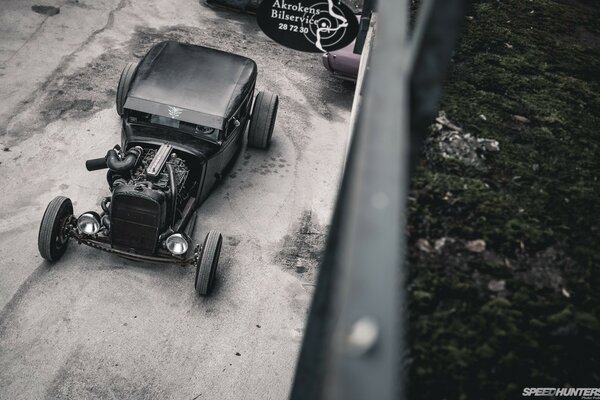 Retro car in black with large headlights