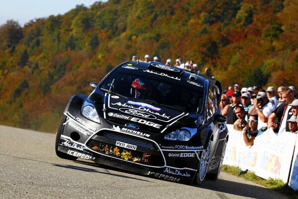 Racing car on the background of the audience