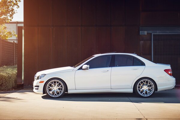 White Mercedes at home on a sunny day