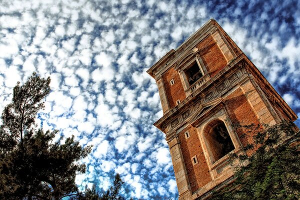 An ancient tower against a cloudy sky