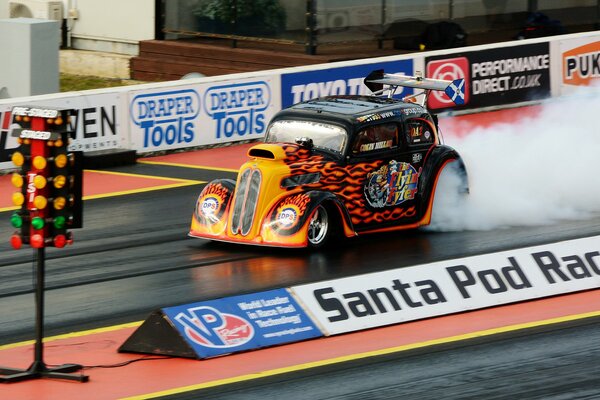 Muscle car with a fiery print on the race