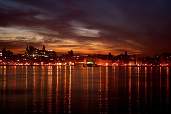 Reflection of city lights in the water at night