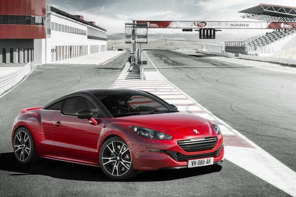 Red Peugeot RCZ 2014 on the highway