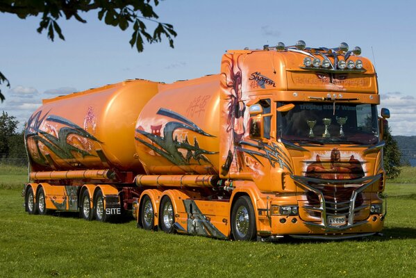 Orange scania truck in the field