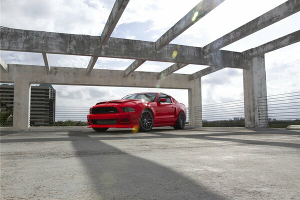 Ford Mustang red over the wreckage