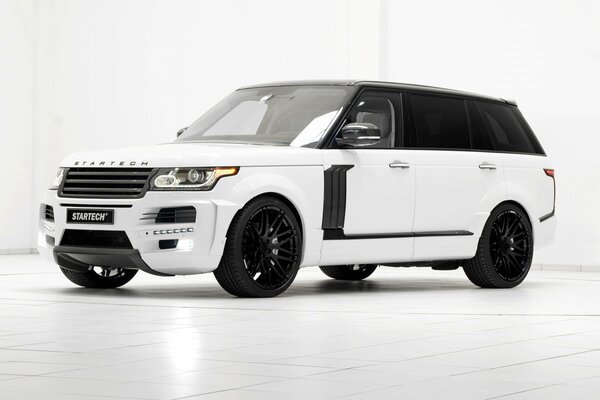 White range rover on stylish black discs