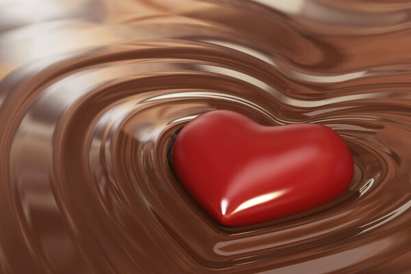 Coeur rouge flottant dans le chocolat liquide