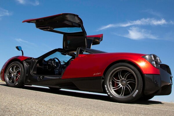 Pagani supercar rear view with open doors