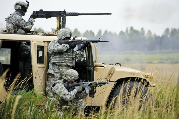 Hummer. Soldiers with rifles. Machine gun