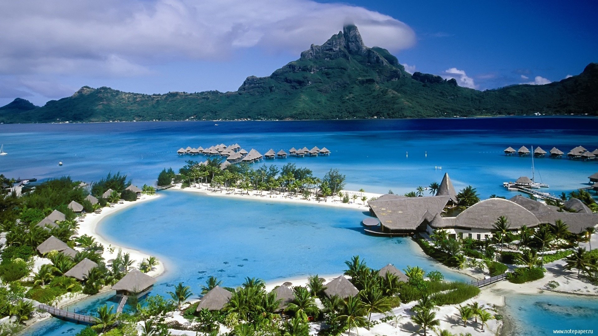 isole sabbia palme laguna oceano montagne case resort alberi cielo nuvole paradiso spiaggia