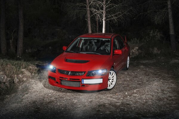 Mitsubishi red car at night