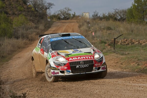 A car rushes through roads and obstacles into the distance