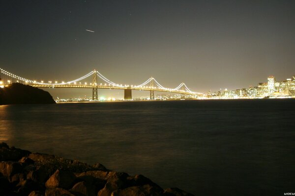 Night landscape with illuminated bridge