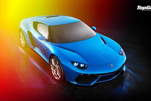 A blue car rides on a colorful background