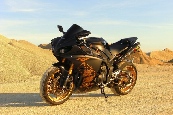 A tuned motorcycle on a desert background