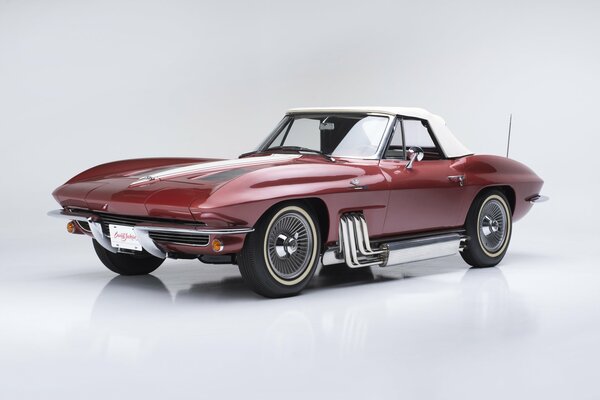 Dark red Chevrolet corvette with convertible body