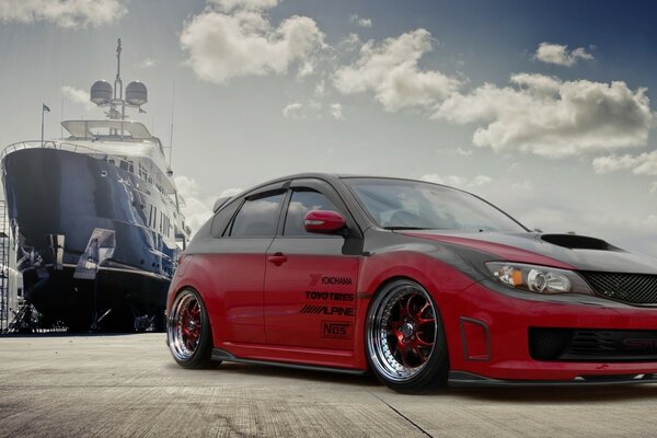 The car is at the port. Beautiful photo of cars. Subaru