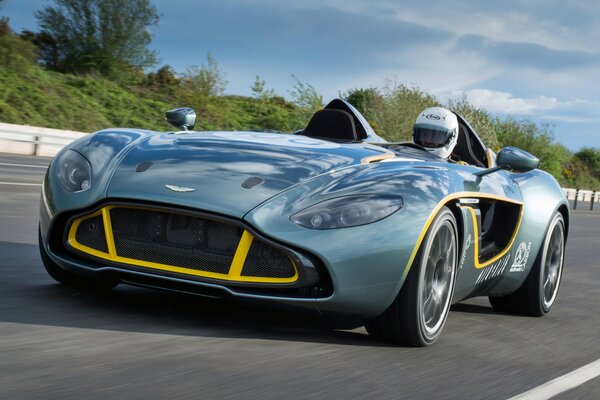 Sporty black Aston Martin with a racer inside