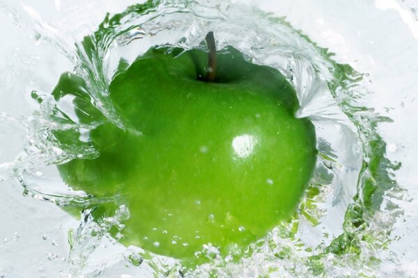 Fruit apple in a whirlpool of water