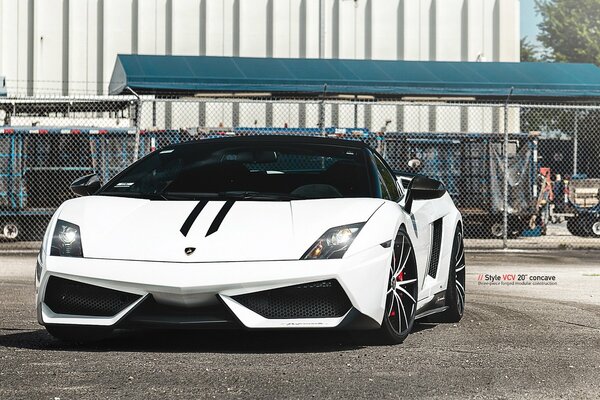 White sports car with black stripes