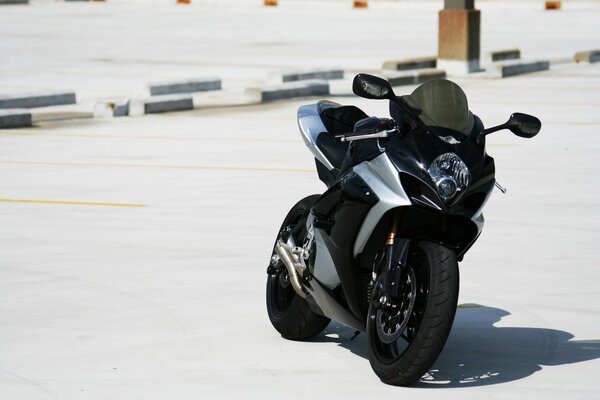 Powerful black sport bike at the start