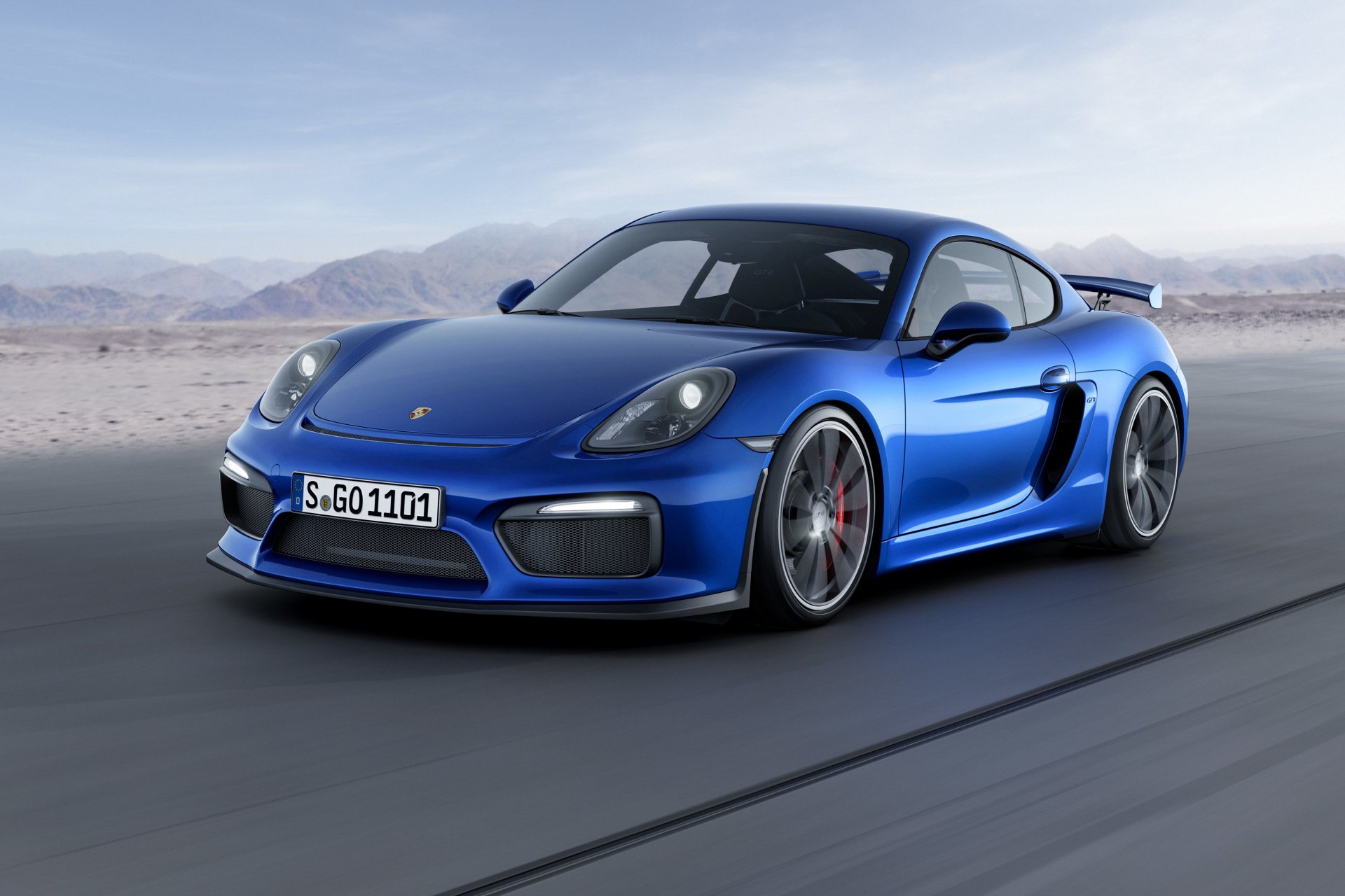 porsche cayman gt4 porsche caimán azul frente montañas cielo fondo