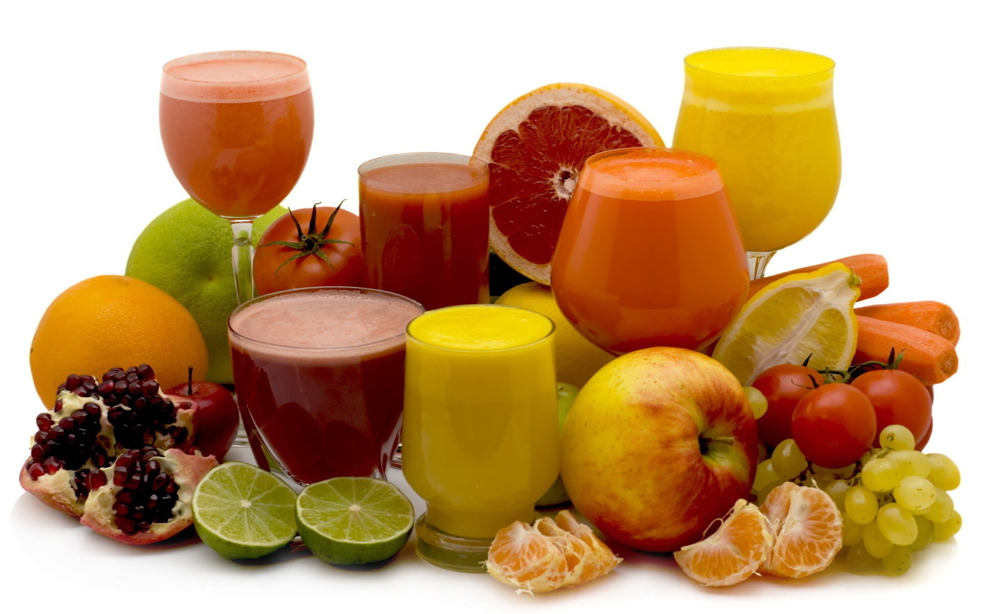 fresh fruits juices glasses background pomegranate fruit tangerine slices lime apple vegetables carrot tomato lemon cherry grapes grapefruit orange fruits drink