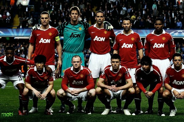 Team photo of football players at the stadium