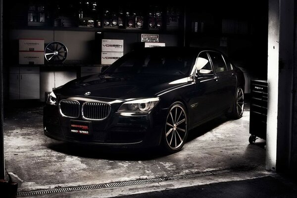 Black BMW in the garage in the dark