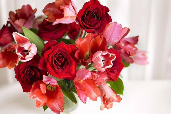 Fragrant bouquet of roses and tulips in a vase