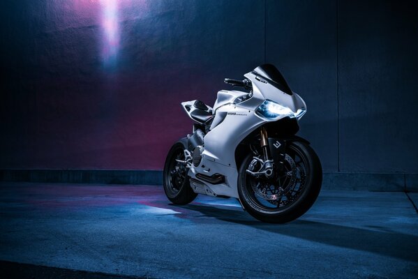 White ducati motorcycle in neon light