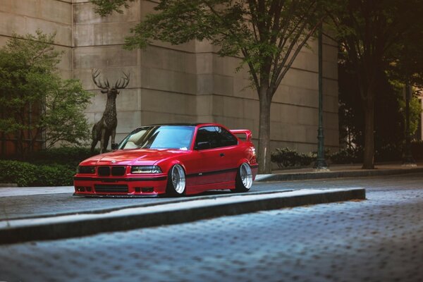 Lowered Red bmw with clear discs