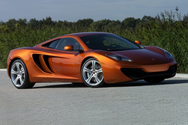 Fiery McLaren on a blue sky background