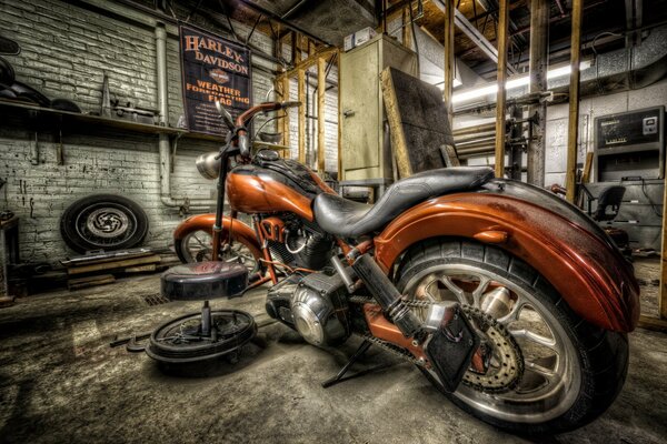 A painted Harley in an abandoned garage